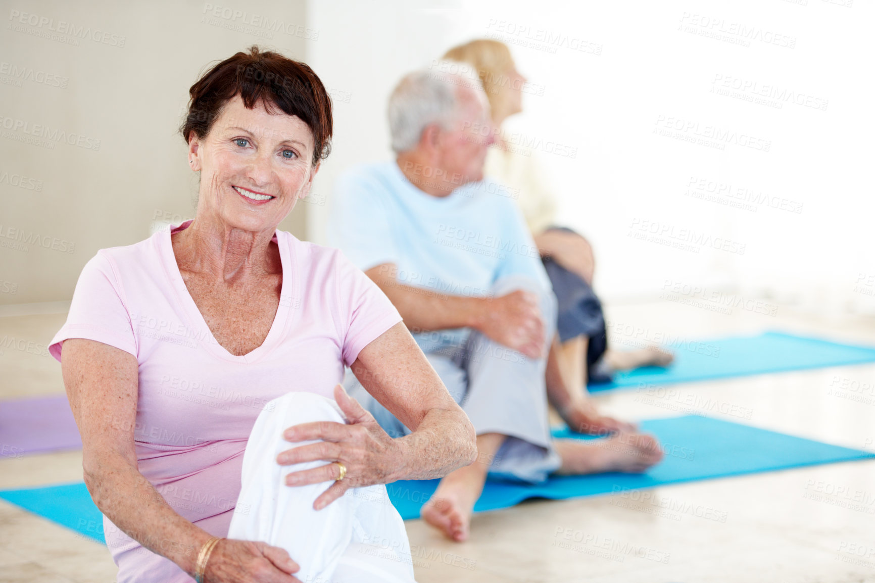 Buy stock photo Old woman, portrait and stretching in gym class for pilates, preparation and wellness. Senior people, instructor and group in health club with warm up, mobility exercise or fitness for retirement
