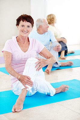 Buy stock photo Yoga, old woman and smile with stretching in class for flexibility, mobility exercise or health. Group, senior person or lord of the fishes pose in studio for fitness, retirement wellness or portrait