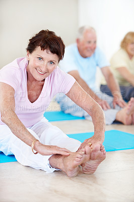 Buy stock photo Senior woman, portrait and stretching in health class for pilates, preparation and wellness. Old people, instructor and group in gym club with warm up, mobility exercise or fitness for retirement