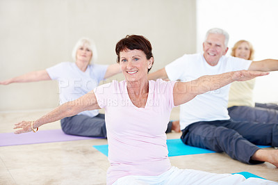 Buy stock photo Stretching, portrait and senior woman in yoga class for wellness, happy or balance in retirement home. Elderly resident, smile and warrior pose in health club for mobility exercise, fitness or cardio