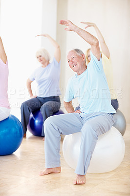 Buy stock photo Group, pilates and stretching with senior friends in studio for fitness, health or wellness. Exercise ball, mobility and smile with old people in gym together for activity, retirement or training