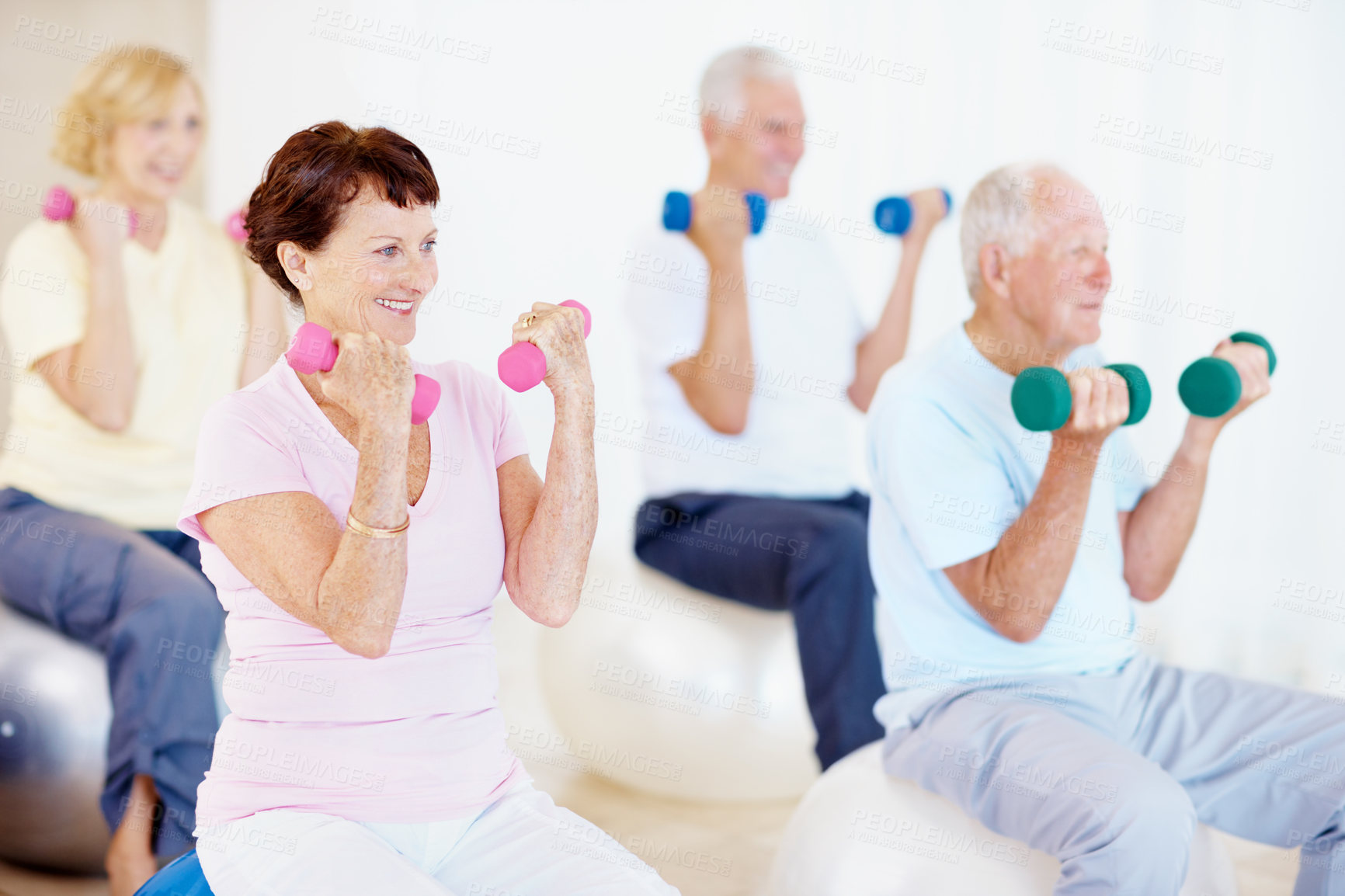 Buy stock photo Dumbbells, workout and old woman in gym class with exercise ball, balance or retirement wellness. Happy, elderly people and lifting weights in health club with equipment, fitness or mobility training