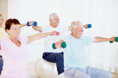 Buy stock photo Dumbbells, workout and old man in gym class with exercise ball, balance and retirement wellness. Happy, elderly people and lifting weights in health club with equipment, fitness or mobility training.