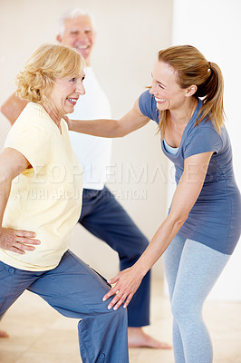Buy stock photo Senior people, support and fitness coach in exercise class for balance, wellness and active retirement. Woman, happy group and instructor for teaching, stretching and together for health in old age