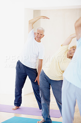 Buy stock photo Pilates, portrait and stretching with old man in fitness studio for training or wellness routine. Exercise, smile and warm up with senior people in gym class for health, retirement or workout