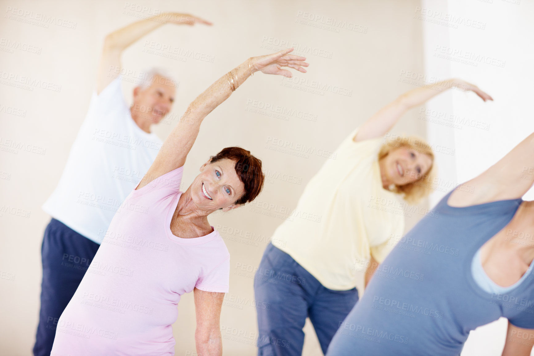 Buy stock photo Pilates, portrait and stretching with old woman in fitness studio for class, training or retirement. Exercise, smile and warm up with group of senior people at gym for health or wellness routine