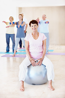 Buy stock photo Old woman, portrait and exercise ball in gym, health and happy for posture improvement or balance. Fitness, class and senior person with workout equipment for core strength, smile and wellness