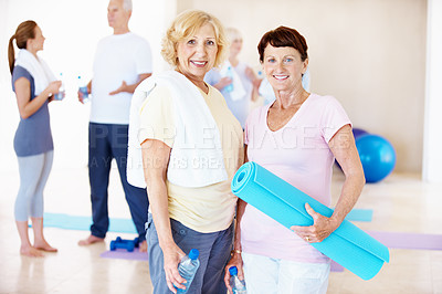 Buy stock photo Fitness, old women and portrait in pilates class for exercise break, retirement wellness and smile. Mat, water and senior people with group in studio for holistic practice, pensioner health and rest
