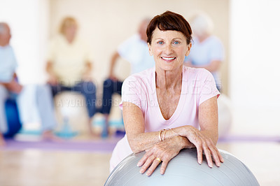 Buy stock photo Elderly woman, portrait and exercise ball in gym for pilates, preparation and wellness. Senior person, smile and group in health club with happiness, mobility development or fitness for retirement