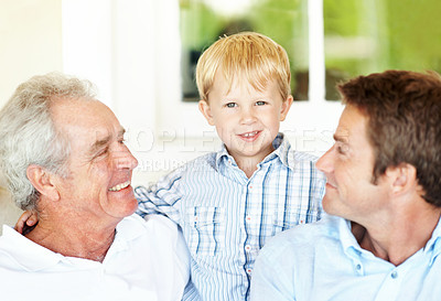 Buy stock photo Happy, family and grandpa with child in house, generations and connection with grandchild in lounge. Senior man, love and people with smile for kid, portrait or fathers day celebration in living room