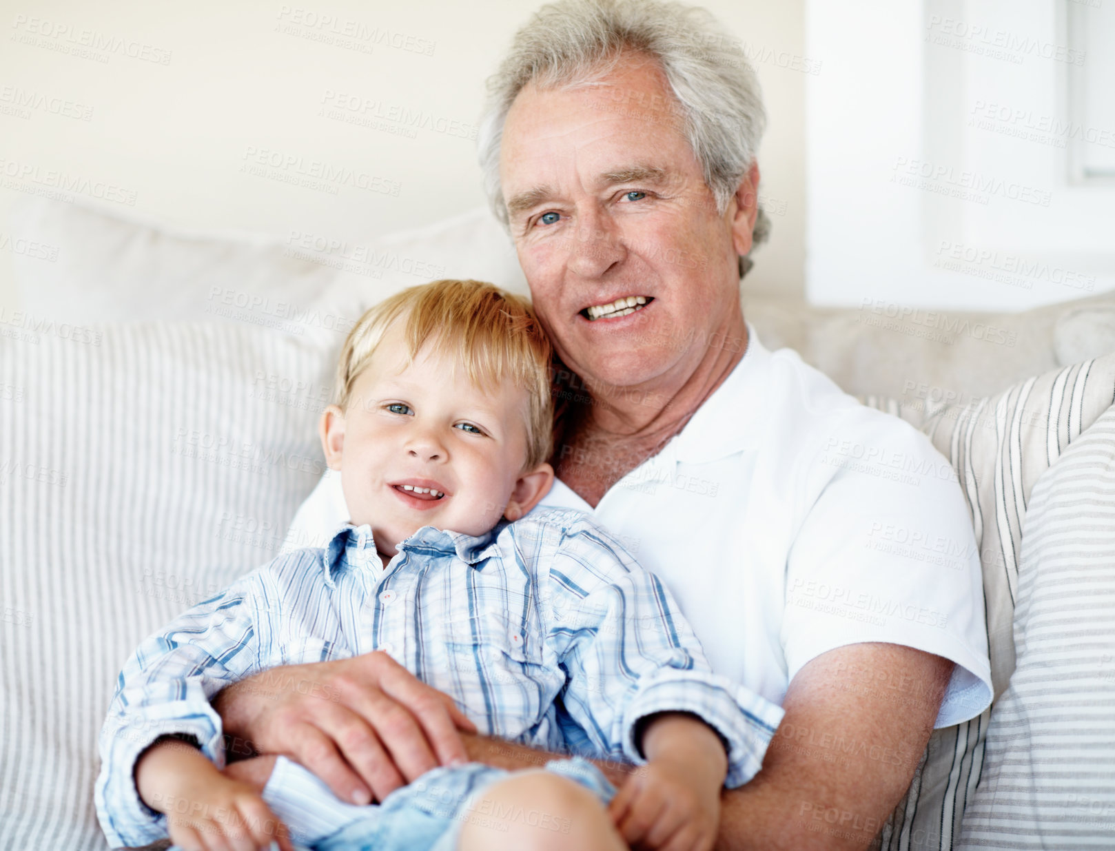 Buy stock photo Smile, portrait and grandfather with child on sofa for bonding, relationship and visit on weekend. Family, relax and senior man with boy on couch for connection, support or affection in home together