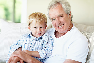 Buy stock photo Smile, portrait and grandpa with kid on sofa for bonding, relationship and visit on weekend. Family, relax and senior man with child on couch for connection, support or affection in home together