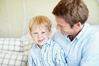 Buy stock photo Family, love and dad with child in lounge, affection and connection with son on weekend and support. Happy man, home and fathers day celebration with kid on couch, portrait and bonding with boy