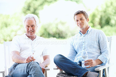 Buy stock photo Garden, portrait and man with dad and wine for bonding, holiday and relax together on weekend. Family, backyard and person with elderly father, alcohol and drink for connection, relationship or visit