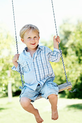 Buy stock photo Smile, swing and portrait of kid in nature with fun, growth or early childhood development. Happy, activity and boy playing outdoor in park, garden or backyard for holiday or break with laughing.