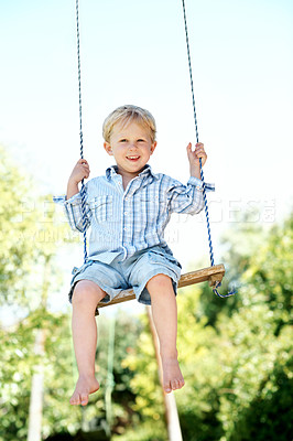 Buy stock photo Happy, swing and portrait of kid in nature with fun, growth or early childhood development. Smile, activity and boy playing outdoor in park, garden or backyard for holiday or break with laughing.