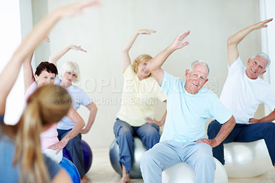 Buy stock photo Group, stretching and instructor in yoga class, routine and exercise together for peace in studio. People, workout and coach training with support, morning or fitness for wellness, energy or calm