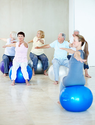 Buy stock photo Coach, yoga and stretching with old people on ball, holistic balance and retirement hobby for zen. Instructor, yogi and warrior pose with senior group for inner peace, spiritual healing and wellness