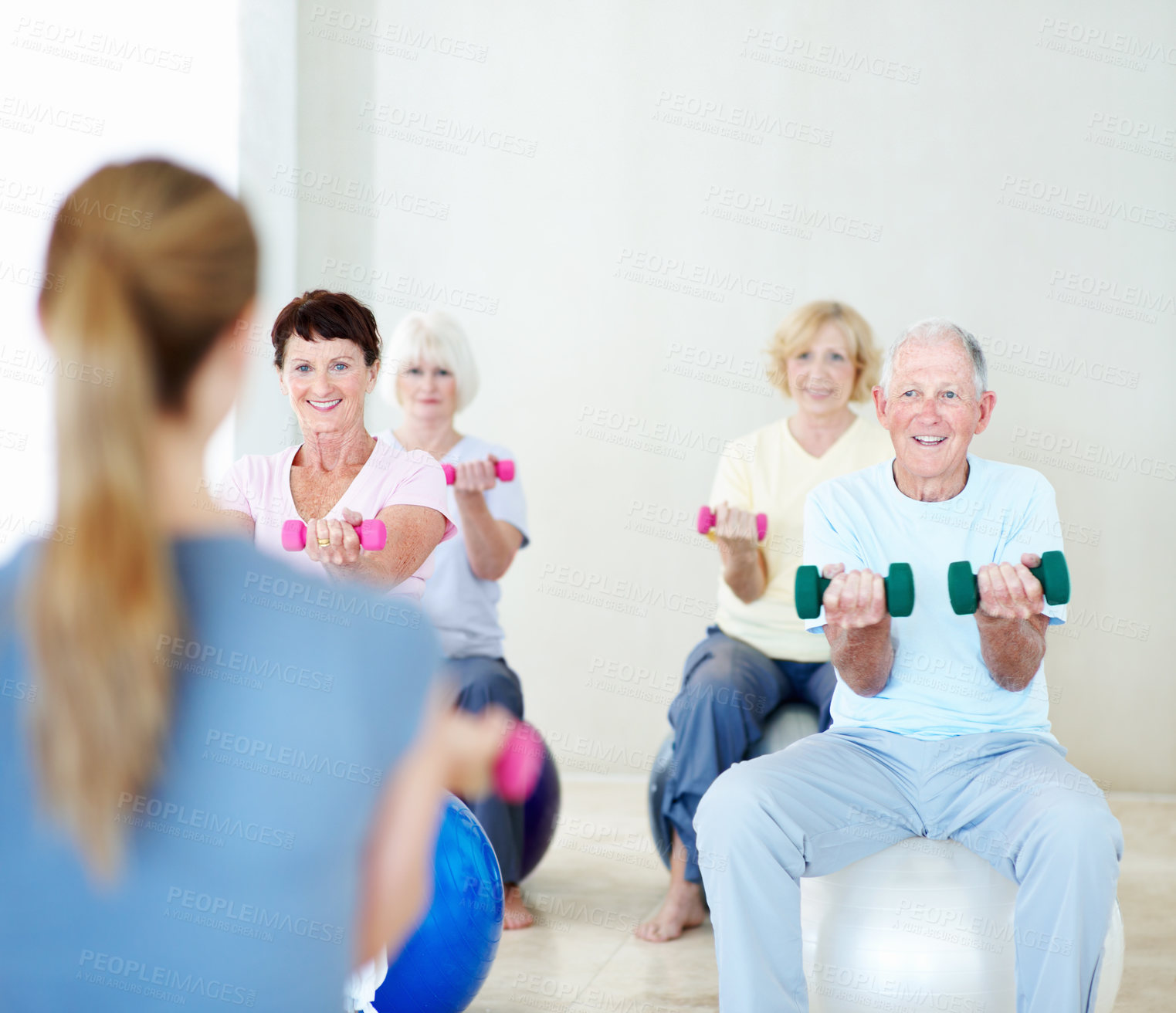 Buy stock photo Dumbbells, fitness and old people with personal trainer in studio for coaching or wellness. Exercise, retirement and weight class with instructor at gym for health, physical activity or training