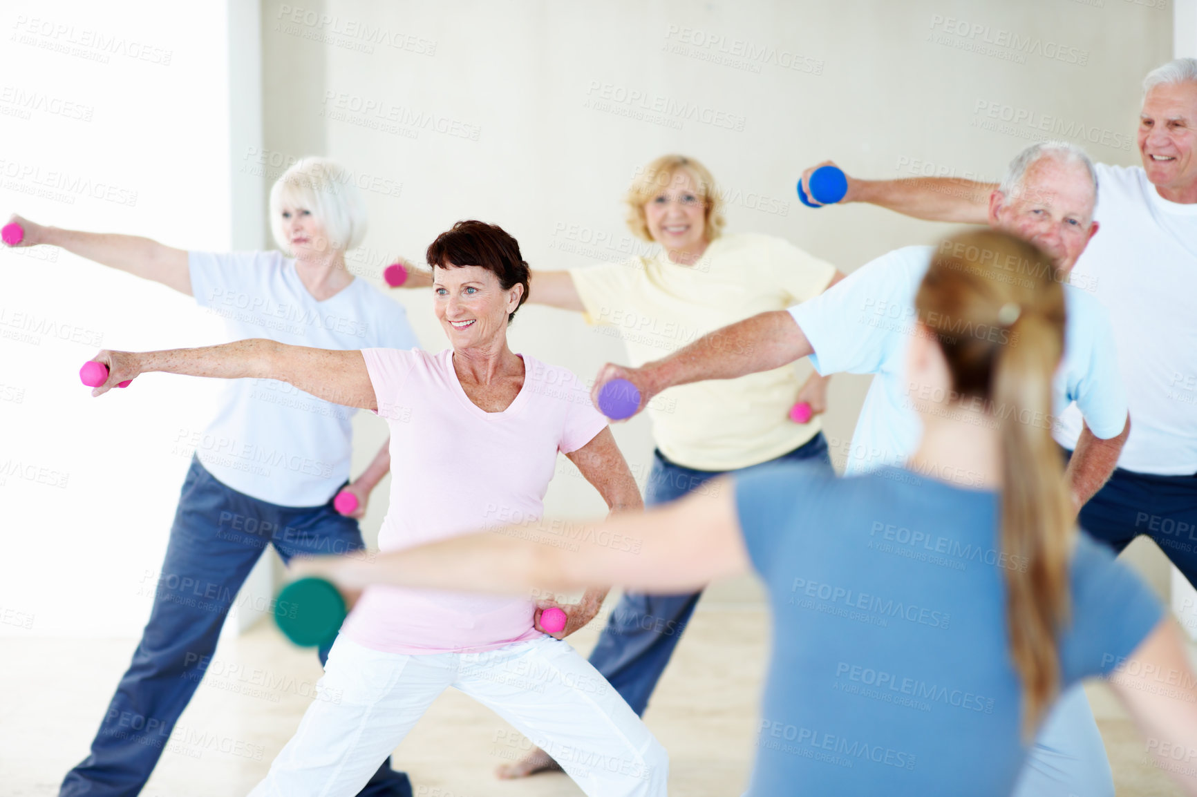 Buy stock photo Exercise, weights and woman with senior people for fitness, wellness and stretching for mobility. Retirement, gym and trainer with elderly group with dumbbells for health, muscle strength and balance