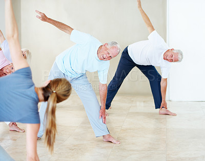 Buy stock photo Smile, coach and stretching with old people for yoga, fitness and assistance for holistic balance. Happy, instructor and triangle pose with senior men for yogi, demonstration and mobility flexibility