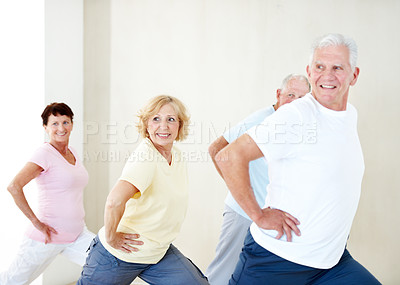 Buy stock photo Elderly people, smile and stretching in gym class for exercise, preparation and wellness. Senior man, instructor and group in health club with warm up, mobility workout or fitness for retirement