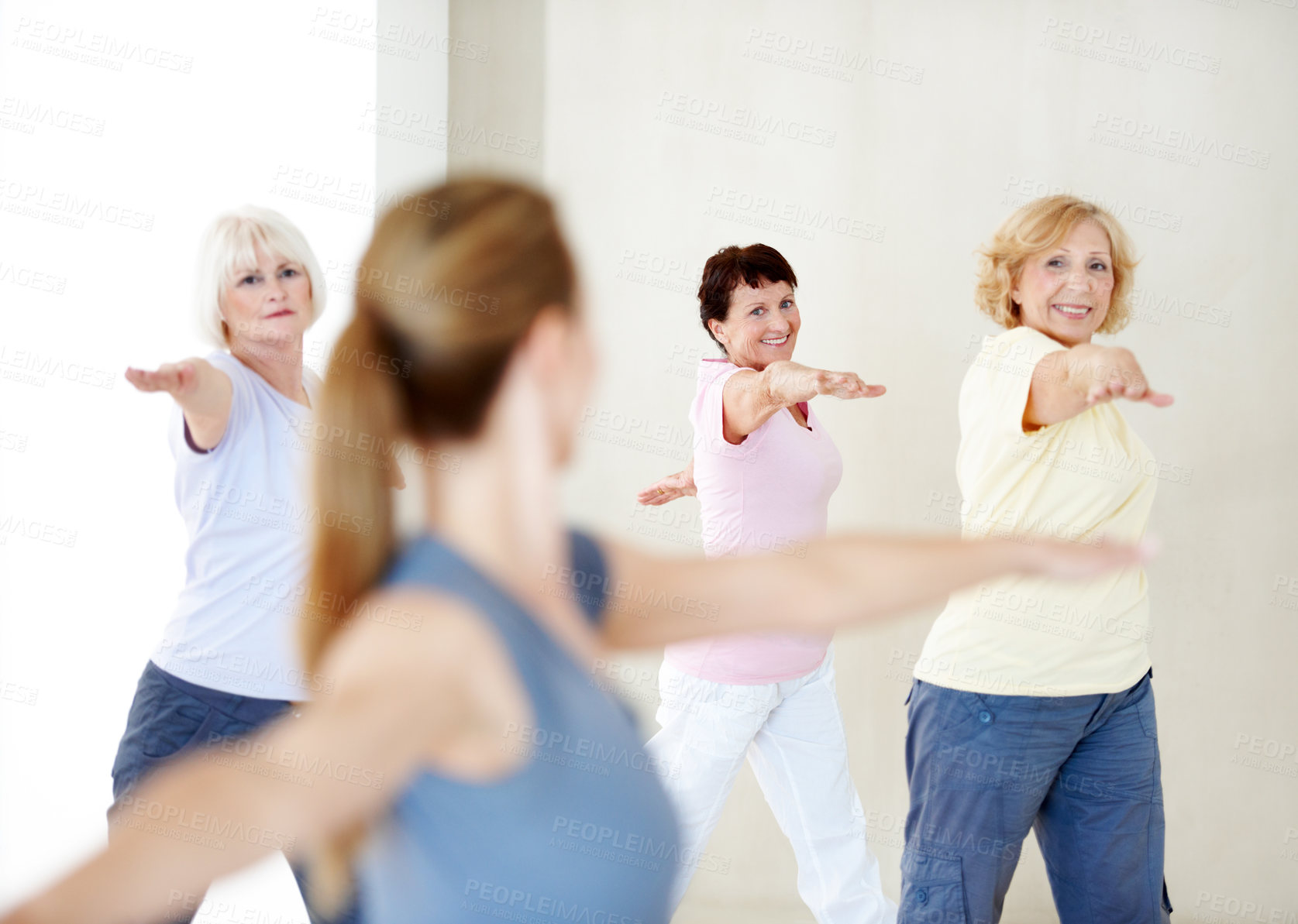 Buy stock photo Woman, stretching and instructor in yoga class, fitness and exercise together for peace in studio. People, meditation and coach training for spiritual health, movement or back for wellness or healing