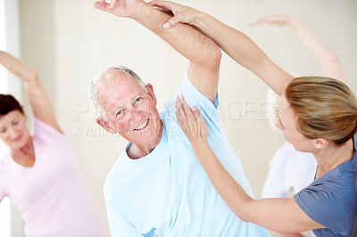 Buy stock photo Support, stretching and old man with instructor at fitness class, physical therapy and wellness. Portrait, trainer and happy people at studio with arm exercise, help and side bend in retirement