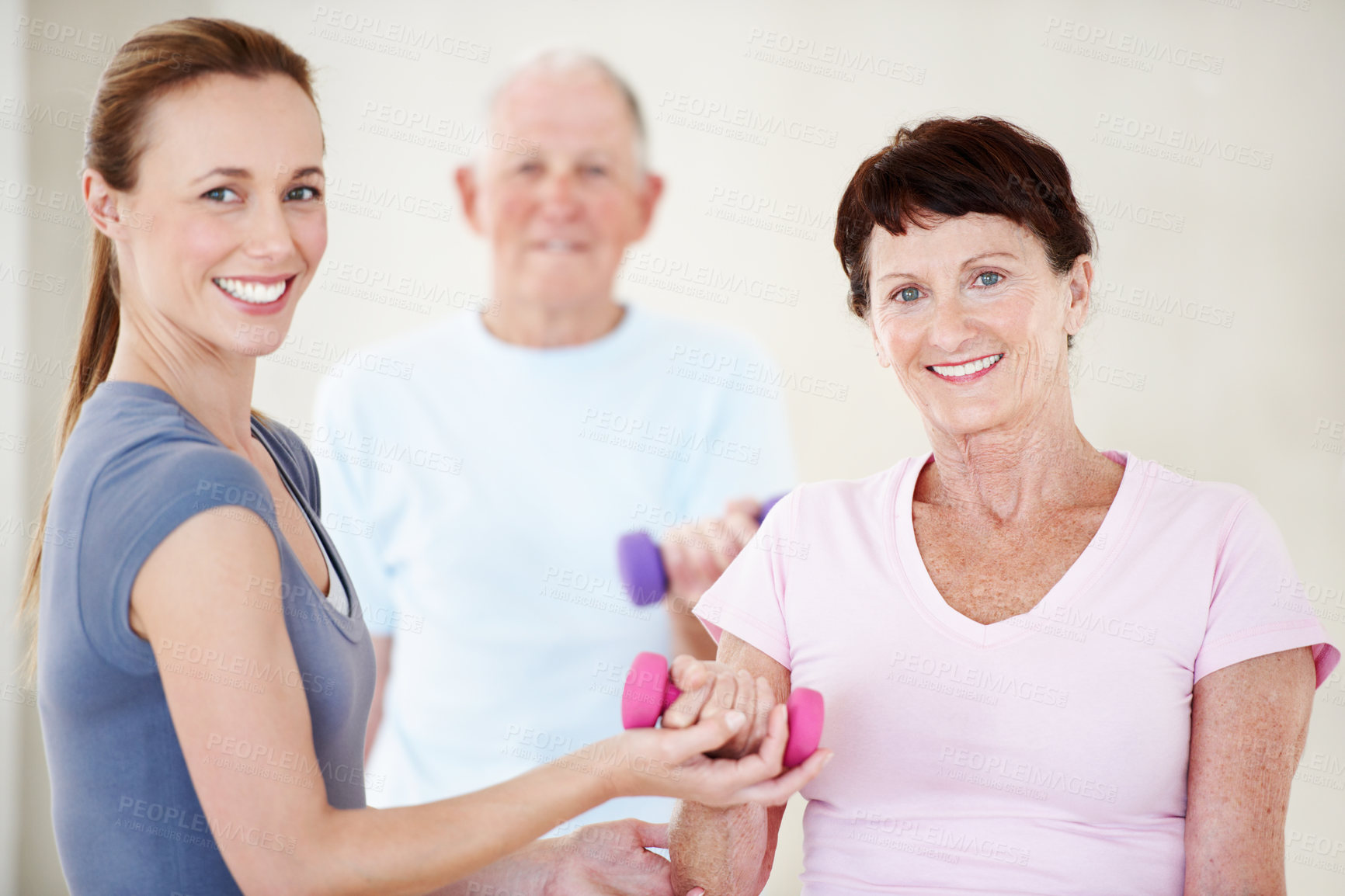 Buy stock photo Fitness, coach or old people in gym class with dumbbell, help or arm workout for wellness. Portrait, trainer or senior woman with equipment, muscle strength or weightlifting support in retirement