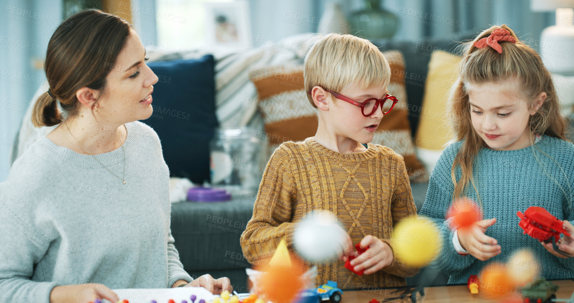 Buy stock photo Bonding, mother or children with toys in home, assembly support or guidance for cooperation activity. Problem solving, woman or siblings with instructions for building set, interactive play or help