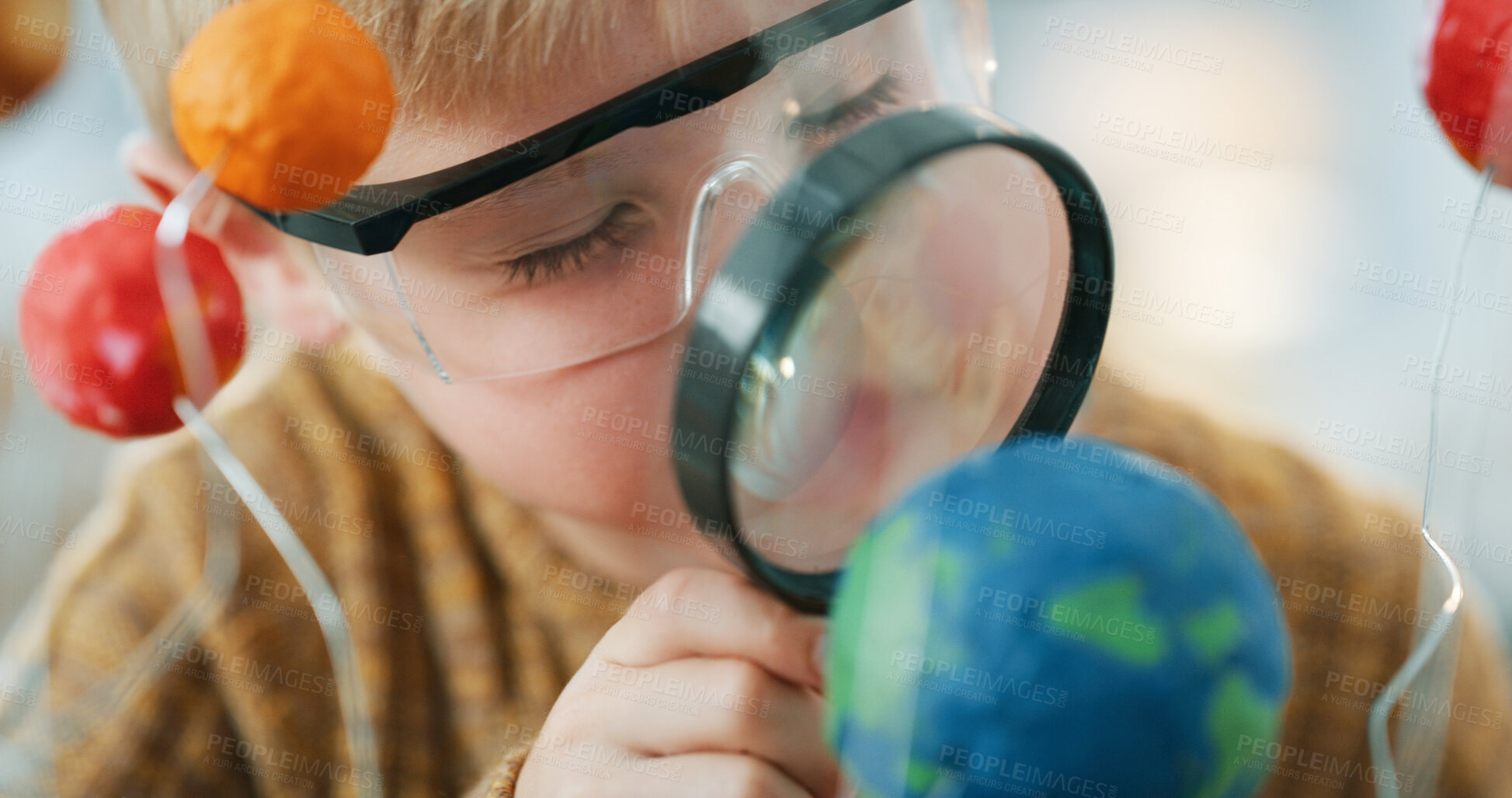 Buy stock photo Child, science and magnifying glass with earth model for project, education or assignment in house. Learning, student and thinking with planet for development, homework or astronomy study in home