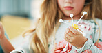 Hands, science and child with atom model for project, education or assignment in house. Learn, student and girl kid with inspection of molecule, particle or element for school homework in apartment.
