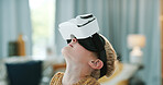 Looking, glasses and child in home with virtual reality, metaverse and gaming in cyberspace. Childhood, house and boy with vr goggles for digital entertainment, futuristic gamer and 3d experience