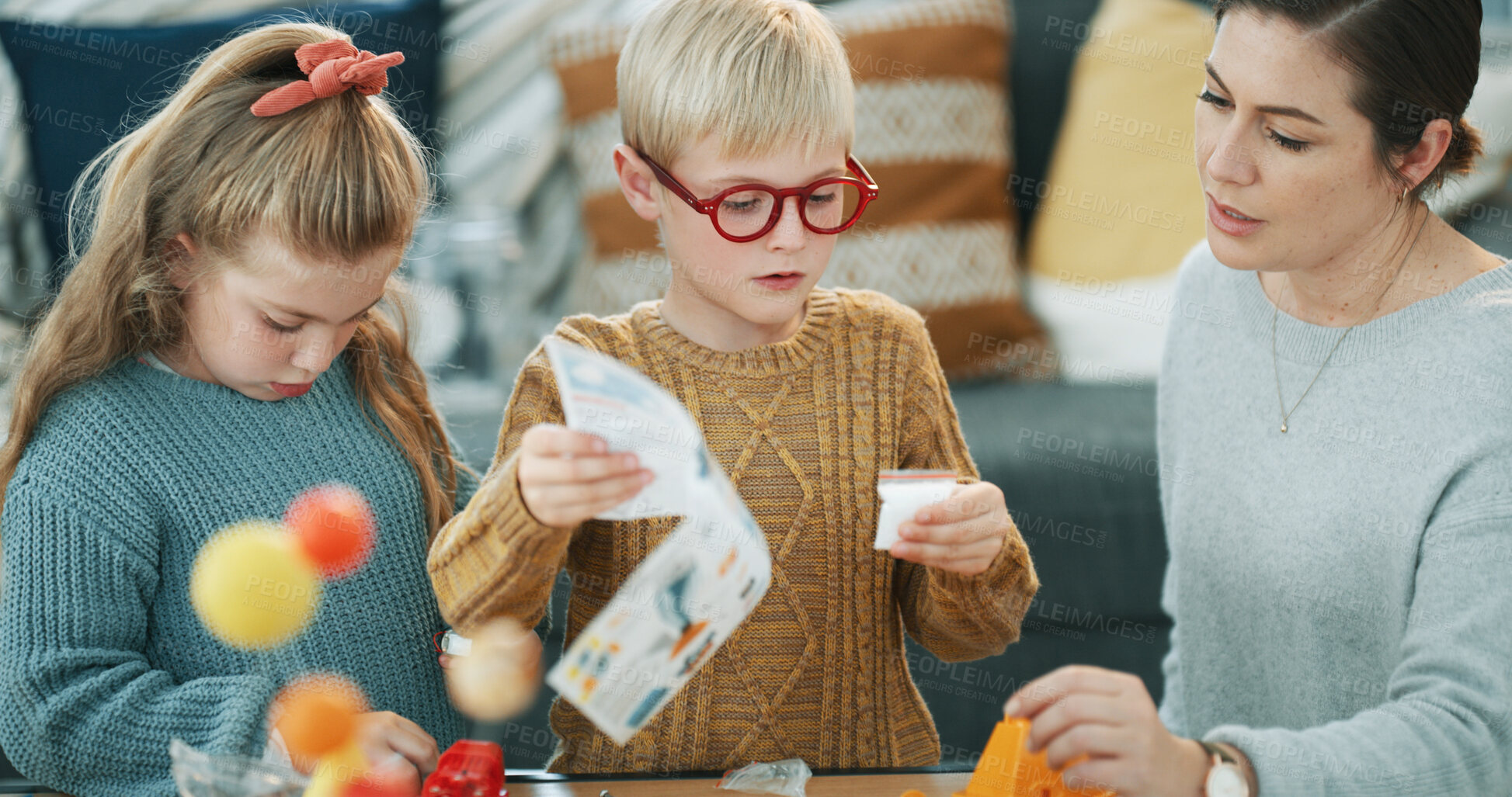 Buy stock photo Mother, children and science toys in home with discussion, learning and bonding for skill development. Woman, kids and talk in lounge with scientific project, help and education for knowledge growth.