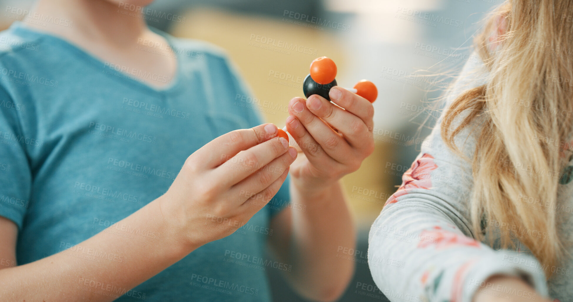 Buy stock photo Child, knowledge and hands with molecular model, growth or development with science homework in home. Geometric, education and kid with atom structure for fine motor skills, learning and assignment