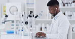 Laptop, black man and scientist in laboratory with earphones for music with medical research. Computer, audio tech and African male biologist with online report on pharmaceutical study with playlist.
