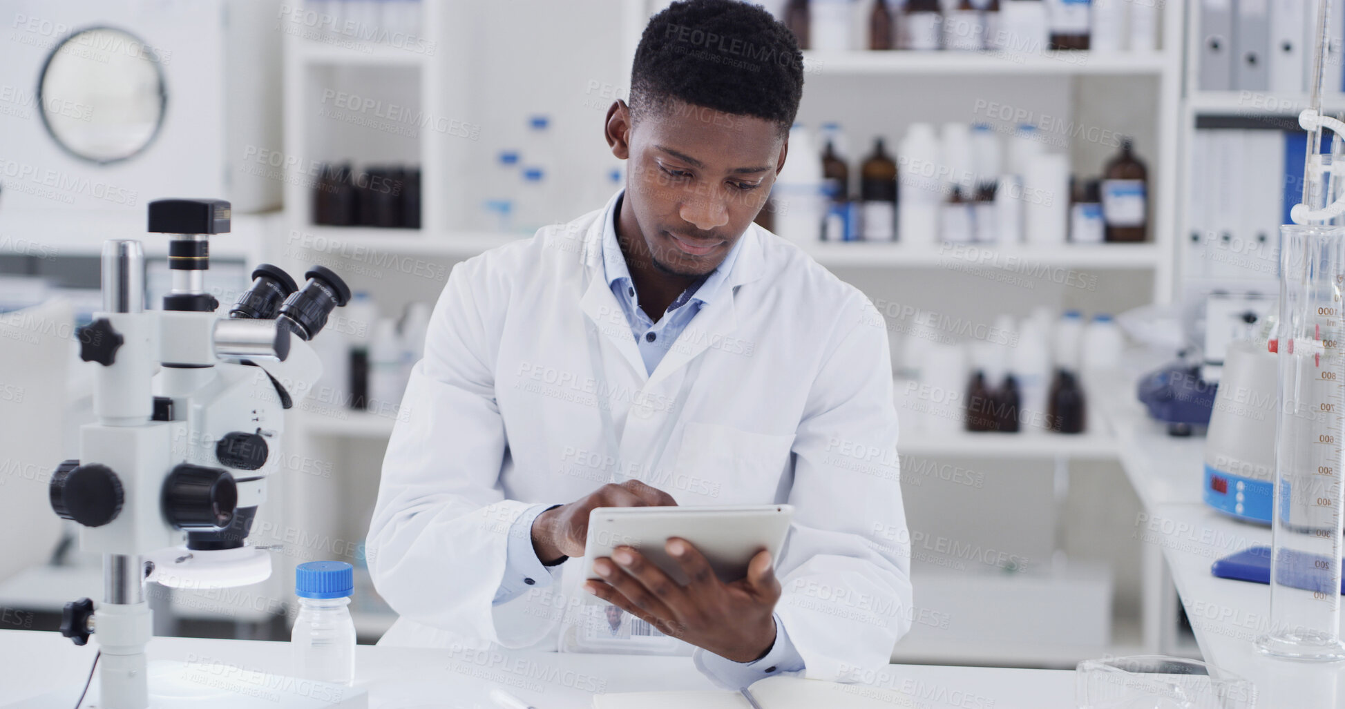 Buy stock photo Scientist, lab or black man with tablet for medical research, discovery or test results. Male person, microbiologist or checking information with technology for science study, cure or clinical trial
