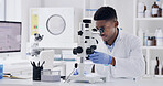Scientist, microscope and exam with black man in lab for forensic research or medical study. Male person, microbiologist or inspection with biotechnology for science, test results or clinical trial