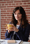 Successful business woman drinking coffee in office smiling confident independent female entrepreneur sitting at desk