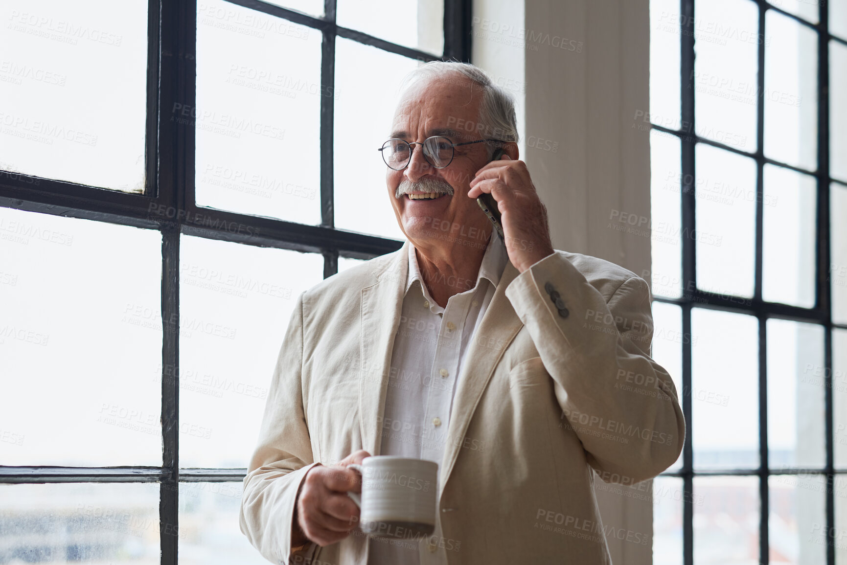 Buy stock photo Coffee, mature or businessman with phone call by window, consulting client or investment discussion. Smile, account feedback or investor with mobile for stocks update, drink or negotiation in office