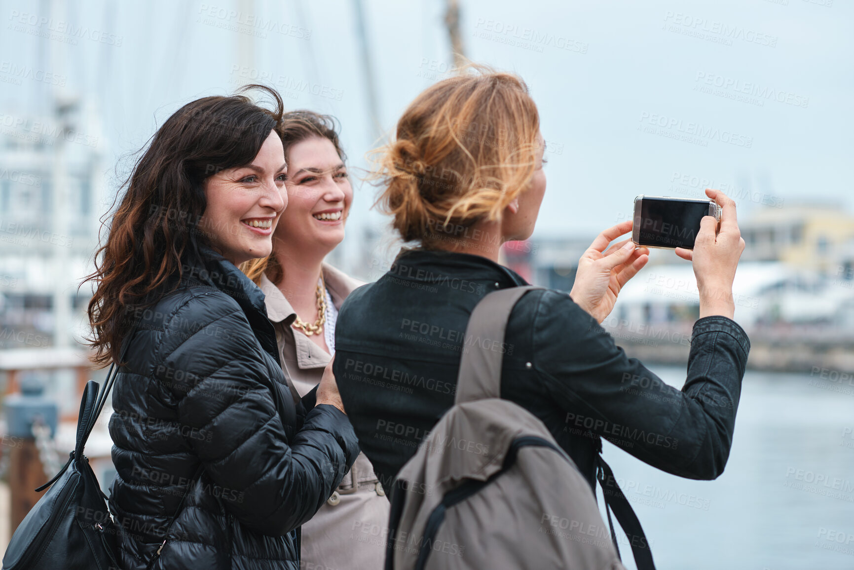 Buy stock photo Travel, photo or friends in town with phone, holiday together or sightseeing post on weekend break. Smile, picture or women in city with connection, bonding trip or tourist memory for social media.
