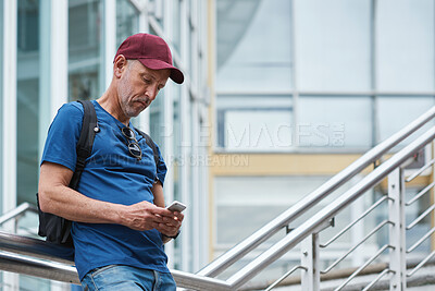 Buy stock photo Phone, city and mature man on vacation, travel directions or social media with online connection. Mobile, outdoor and person on holiday in town for internet guide, navigation app and tourism website