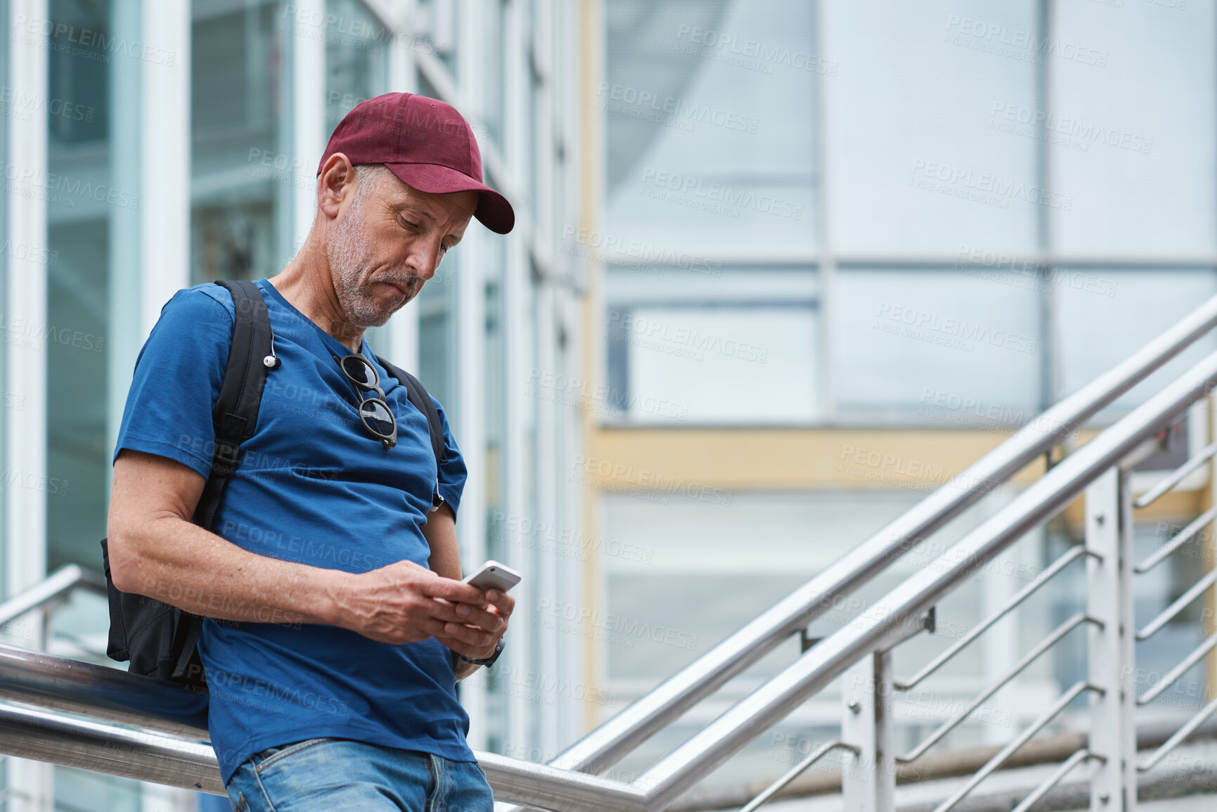 Buy stock photo Phone, city and mature man on vacation, travel directions or social media with online connection. Mobile, outdoor and person on holiday in town for internet guide, navigation app and tourism website