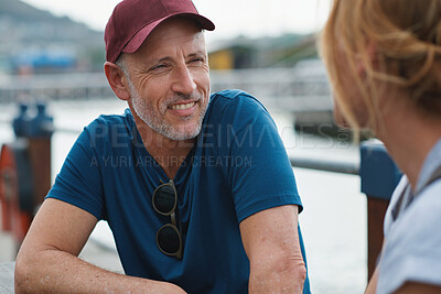 Buy stock photo Man, travel and conversation in harbor for holiday, date and smile for summer bonding. Mature couple, woman and tourist with connection, vacation and together for honeymoon or romance on waterfront