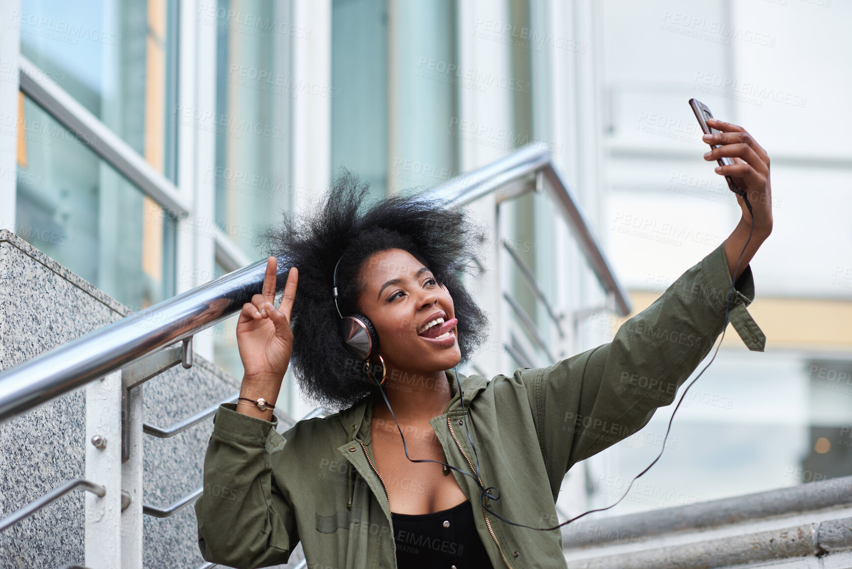 Buy stock photo Headphones, selfie and black woman in city on holiday, getaway or weekend trip for memory with music. Happy, peace sign and female person with audio tech for playlist with photography picture in town