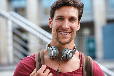 Buy stock photo Commuting, portrait and man with backpack in city, education or student with scholarship opportunity. Outdoor, academic or happy person with headphones, confident and  travel to university in Germany