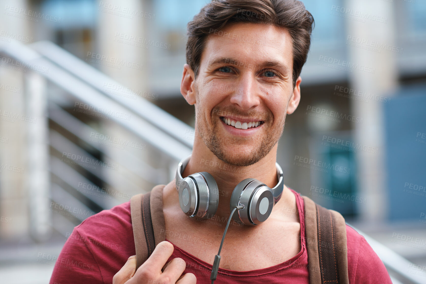 Buy stock photo Commuting, portrait and man with backpack in city, education or student with scholarship opportunity. Outdoor, academic or happy person with headphones, confident and  travel to university in Germany