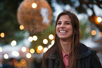 Buy stock photo Night, woman and smile in city with travel, lights and positive mindset for weekend break outdoor. Bokeh, happy female person thinking and explore downtown with wellness, good mood and calm evening.