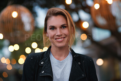 Buy stock photo Night, portrait and woman with travel for holiday, festival experience and abroad for weekend getaway. Bokeh, evening attraction and person with smile for tourism, overseas vacation and local event