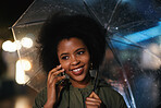 African american woman using smartphone having phone call talking on mobile phone holding umbrella in rainy city at night